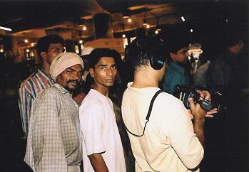 Ajay and spectators at market